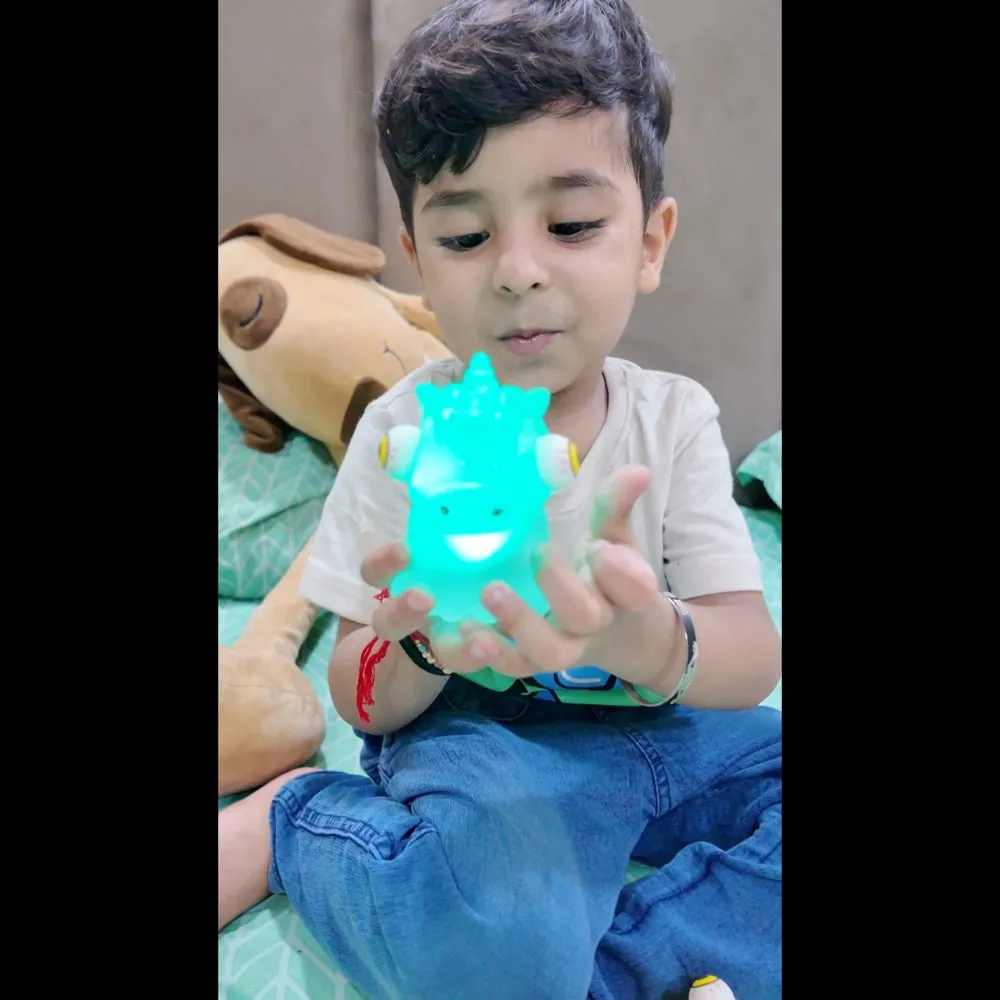 Scoobies Stick-i-dgets | Pack of 1 | Available in dinosaur shape with vibrant orange color | Soft and squishy with glow in the dark feature | Squeeze it and its eyes pop out | Good for hand muscle exercises and fidgeting