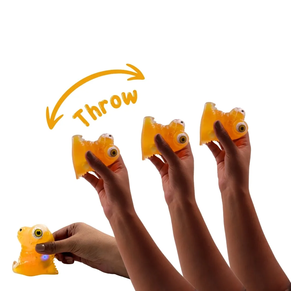Scoobies Stick-i-dgets | Pack of 1 | Available in dinosaur shape with vibrant orange color | Soft and squishy with glow in the dark feature | Squeeze it and its eyes pop out | Good for hand muscle exercises and fidgeting